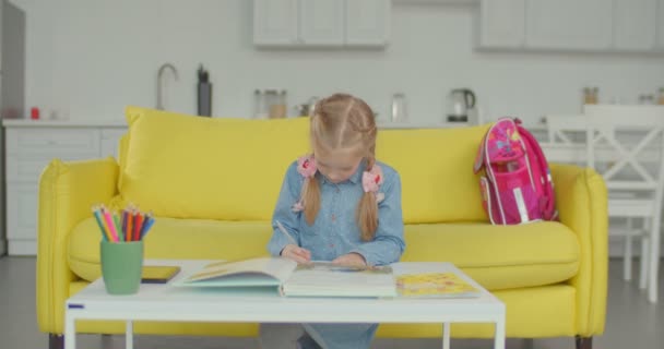 Adorable Schoolgirl Tired Studying Doing Homework Looking Away Sadly Bored — Stock Video