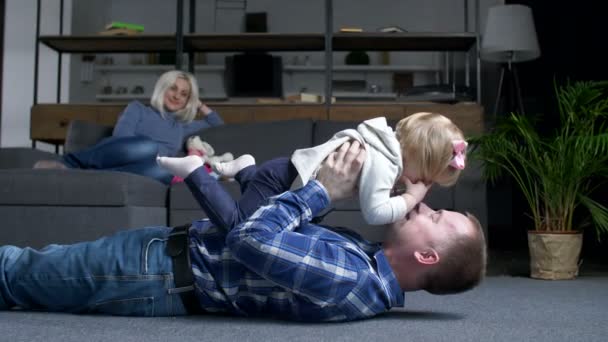 Loving father having fun with little girl at home — Stock Video