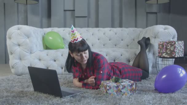 Excited woman making video call on laptop at home — Stock Video