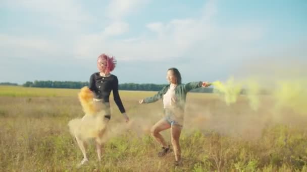 Women Swinging With Colored Smoke Bombs Outdoors