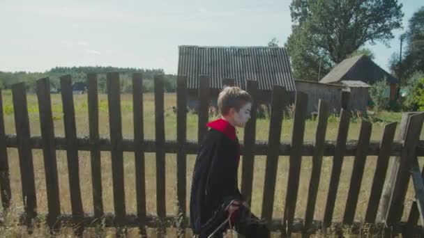 Cute boy in halloween costume going for treats — Stock Video