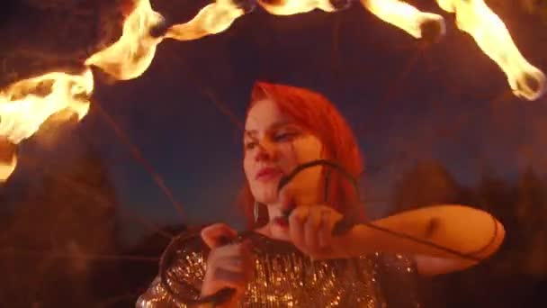 Portrait of lovely woman playing with fire fans — Stock Video