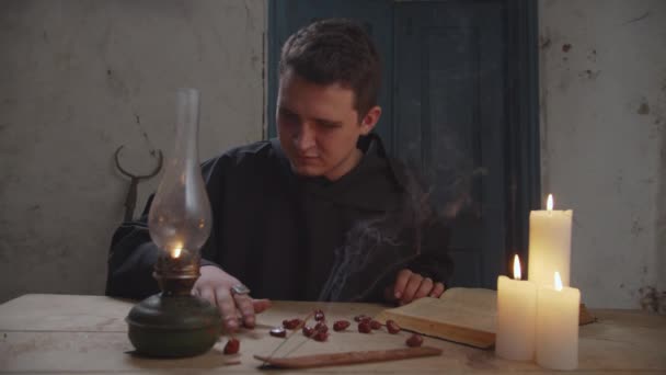 Wizard predicting future with runic magic indoors — Stock Video