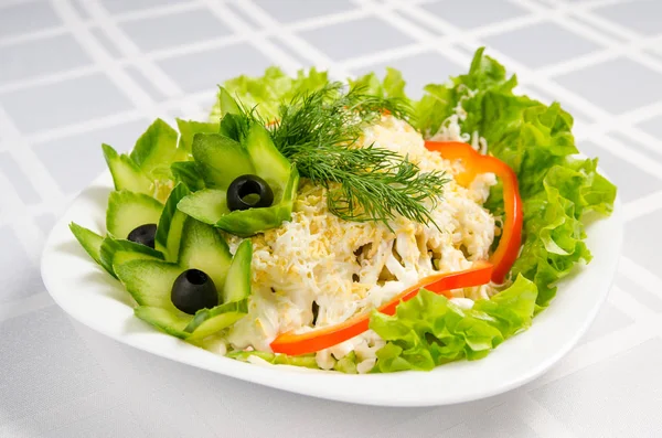 seafood salad - squid, crab sticks, cucumbers, eggs, mayonnaise,