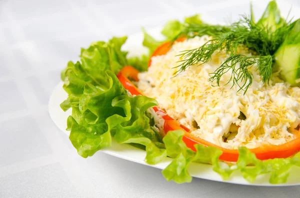 seafood salad - squid, crab sticks, cucumbers, eggs, mayonnaise,