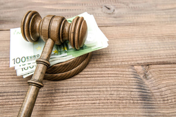 Judges gavel and euro banknotes. Auctioneer hammer with soundboard