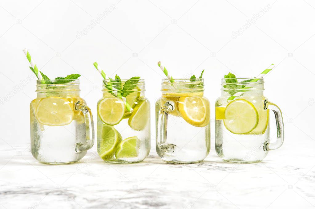 Fresh drink with lime, lemon, mint and ice. Cold summer lemonade