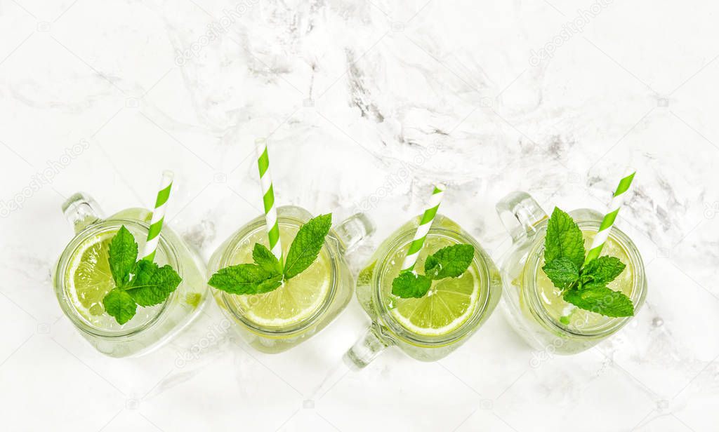 Cocktail drink with lime, lemon, mint and ice. Fresh summer lemonade