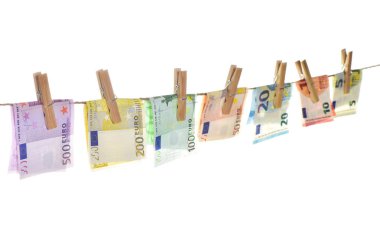 Euro banknotes hanging a rope with clothes pins. Money background. Selective focus clipart