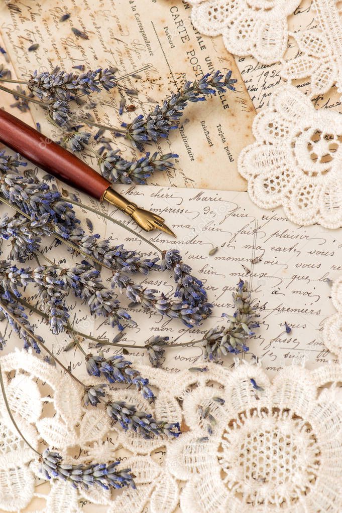 Vintage ink pen, dried lavender flowers and old love letters