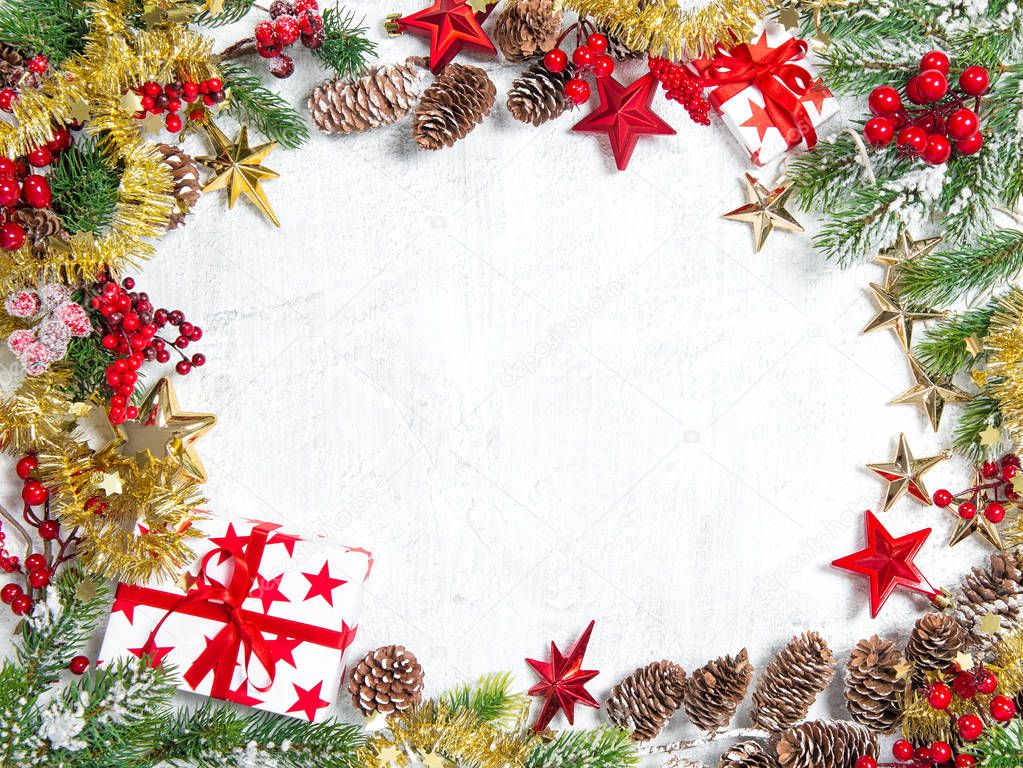 Christmas tree branches with gifts, stars, red decoration on white background. Winter holidays concept