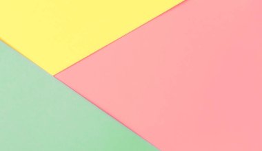 Renkli kağıt arka plan pembe sarı nane. Düz yatıyordu