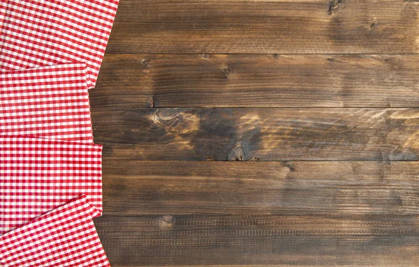 Wooden kitchen table background chequered tablecloth — Stock Photo, Image