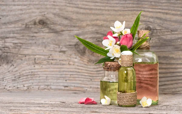 Eucalyptus jasmine roses flower massage oil in bottle — Stock Photo, Image