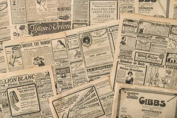 Newspaper pages with antique advertising. Vintage fashion magazine for woman