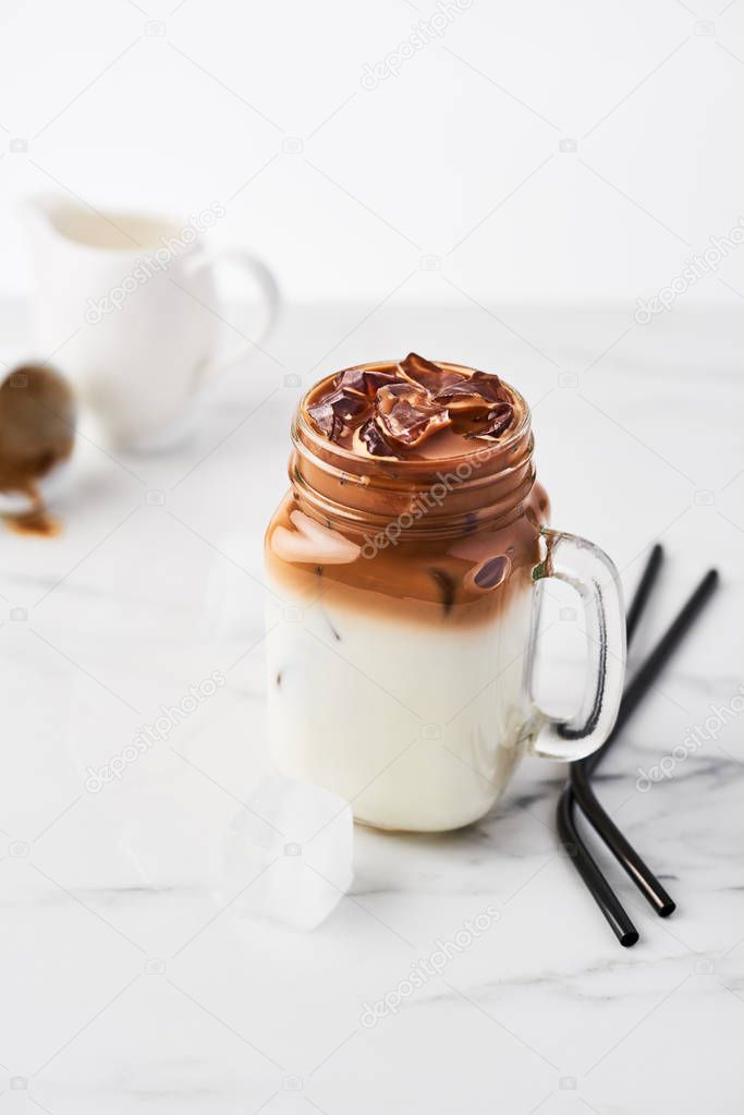 Ice coffee with milk in mason jar