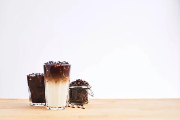 Iced coffee and latte macchiato in tall glass — Stock Photo, Image