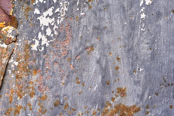 Rusty metal surface with dark blue paint flaking and cracking te — Stock Photo, Image