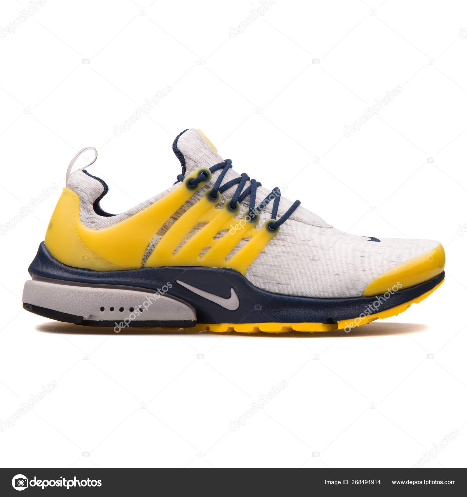 navy blue and yellow sneakers