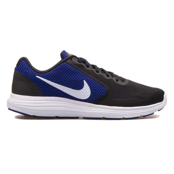 Nike Revolution 3 svart og blå sko – stockfoto