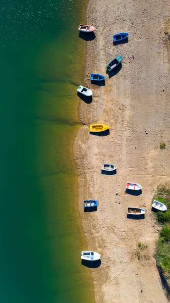 Aerial view of boats on the beach.