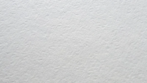 Beyaz suluboya kağıt. Kabataslak bir arka plan. Aquarelle tahılları uzay tuvalini kopyalıyor. Kağıt dokusu çizimi.