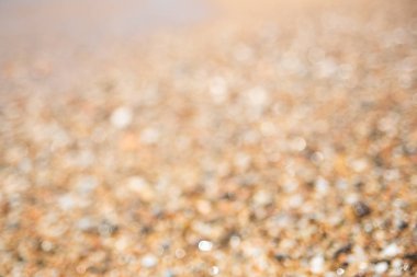 Kahverengi çakıl bulanık arka plan. Yumuşak odak