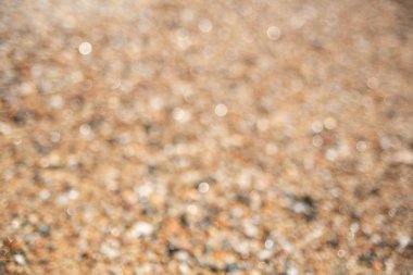 Kahverengi çakıl bulanık arka plan. Yumuşak odak