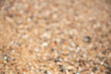 Kahverengi çakıl bulanık arka plan. Yumuşak odak