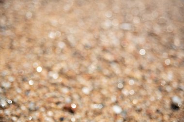 Kahverengi çakıl bulanık arka plan. Yumuşak odak