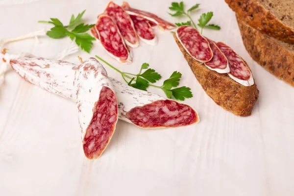 Salami Bread White Wooden Background Top View Copy Space — Stock Photo, Image