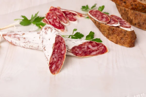 Salami Bread White Wooden Background Top View Copy Space — Stock Photo, Image