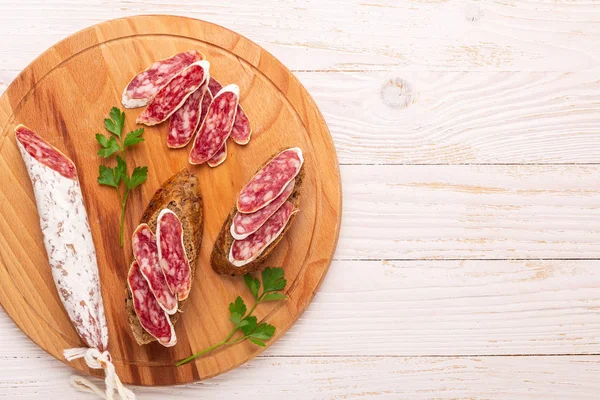 Salami Bread White Wooden Background Top View Copy Space — Stock Photo, Image