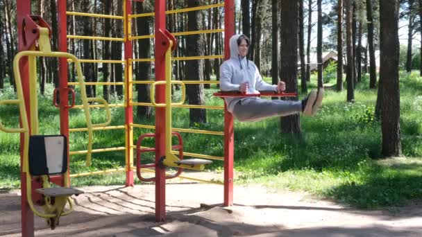 Single Young Man Doing Exercises Street Gym Apparatus Park Street — Stock Video