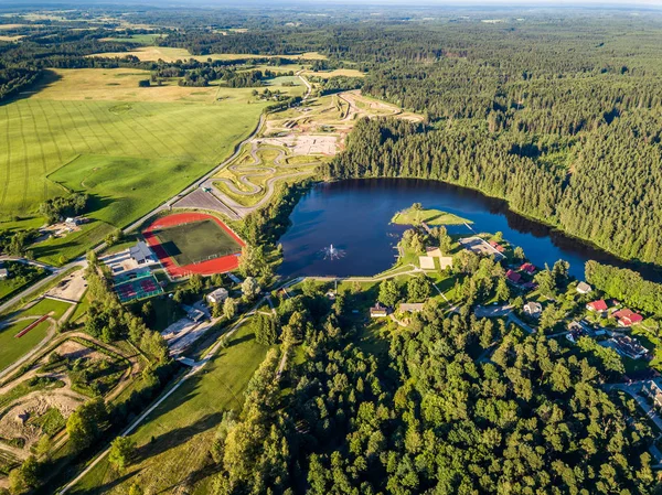 Aerial Drone Photography of the City with the Lake and Stadium Surrounded in Beautiful Spring Colors on a Sunny Day