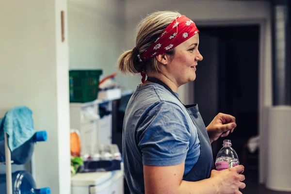 Female Chef Taking a Break from Meal Preparation - Happy, Smiling, Concept of a Hard Working Person, Vintage Film Look