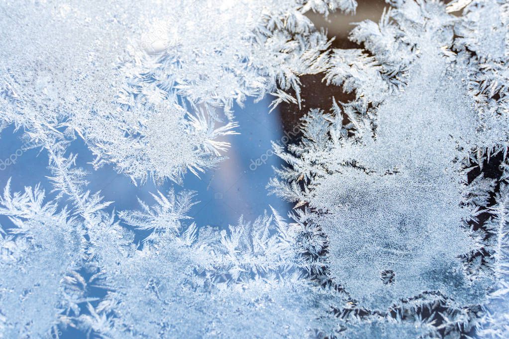 Closeup Photo of Details in Hoarfrost on Window on a Sunny Winter Day - Abstract Background with Pattern