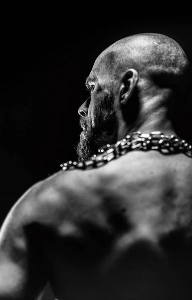 black and white portrait of a strong man from the back 