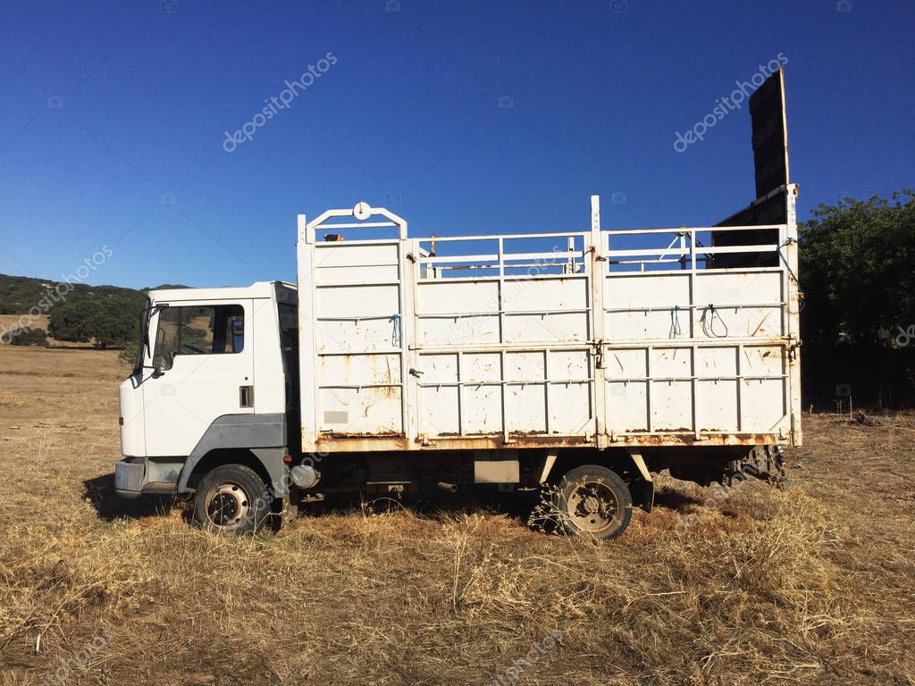 Old cattle transport truck already abandoned and semi disintegrated by rust