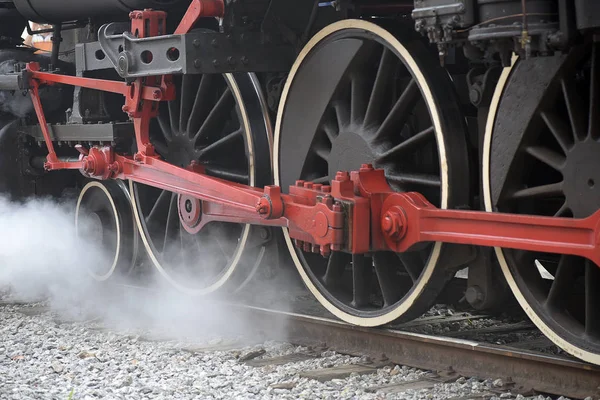 Close-up of old steam locomotive wheels, now tourist attraction of the city of Guararema, in Sao Paulo, Brazil