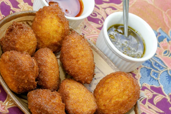 Brazilian food: acaraje with typical fillings, in a table of regional food restaurant