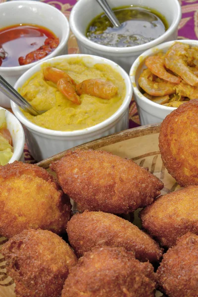Brazilian food: acaraje with typical fillings, in a table of regional food restaurant