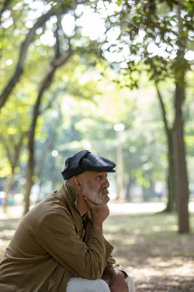 Old man pensive and sad about his prospects