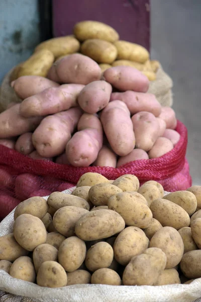 Bulk potato bags in open air market stall