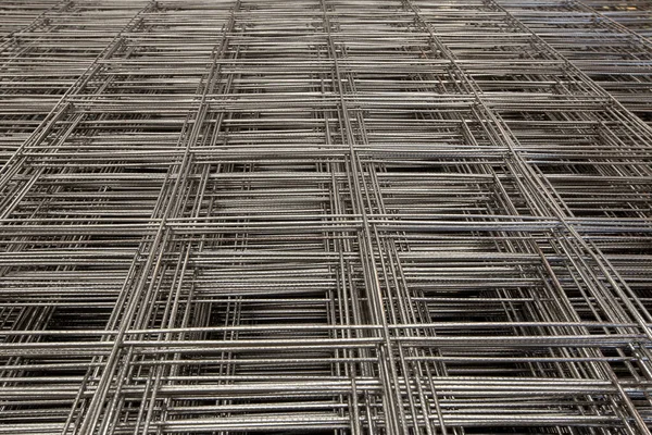 Abstract composition with pile of steel mesh for reinforced concrete structure