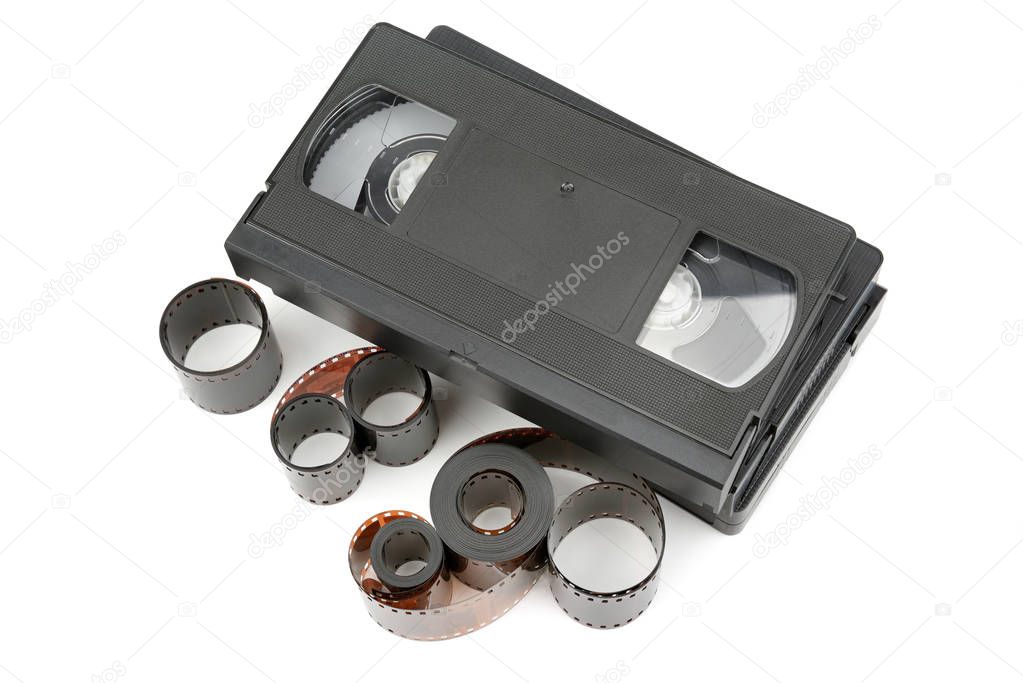 A set of video tapes and photographic film isolated on white background. Flat lay, top view.