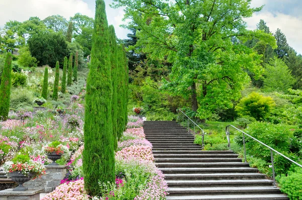 Flower garden and other plants, a staircase and a waterfall on the island of Mainau (Lake Constance, Germany)