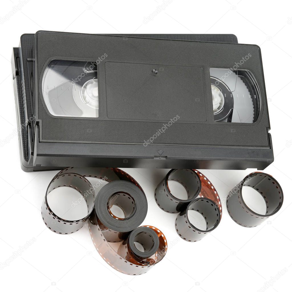 A set of video tapes and photographic film isolated on white background. Flat lay, top view.