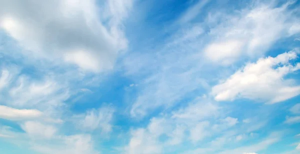 Light clouds in the blue sky. Wide photo