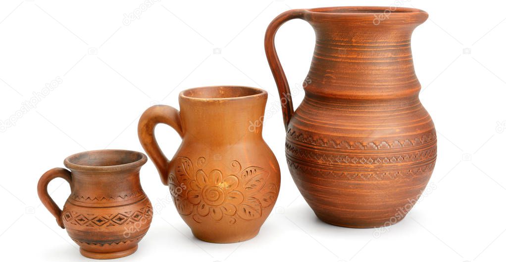 Set of old ceramic pot and mug - kitchen retro equipment of cooking isolated on white background. Wide photo